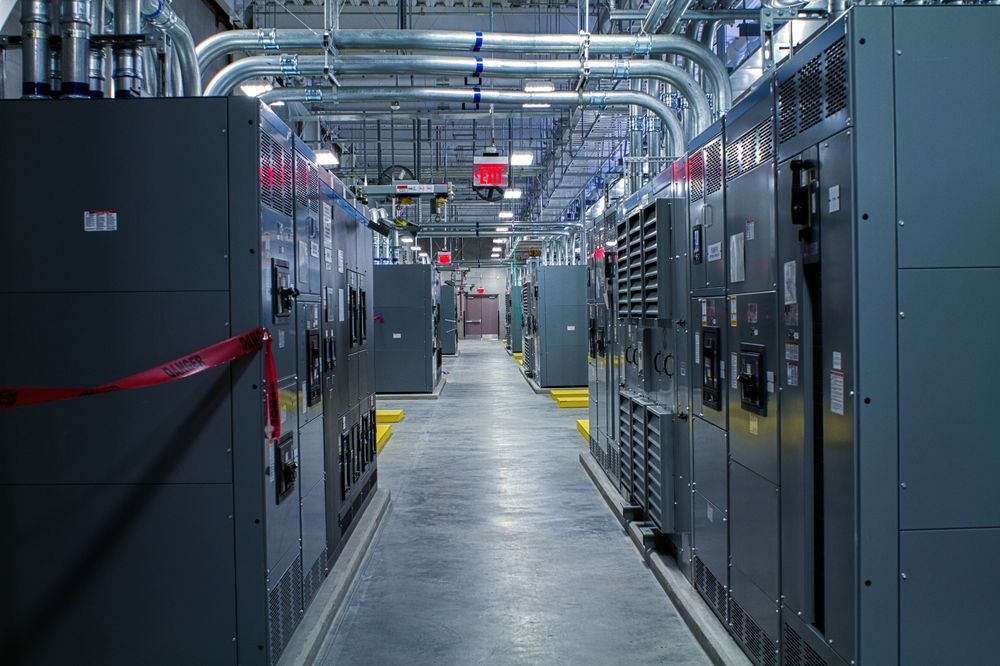 Row of electrical switchgear inside a data center